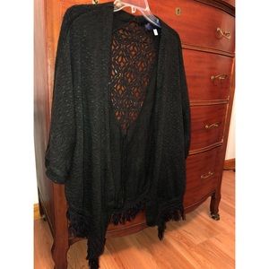 A black sweater with beautiful lace cut outs.